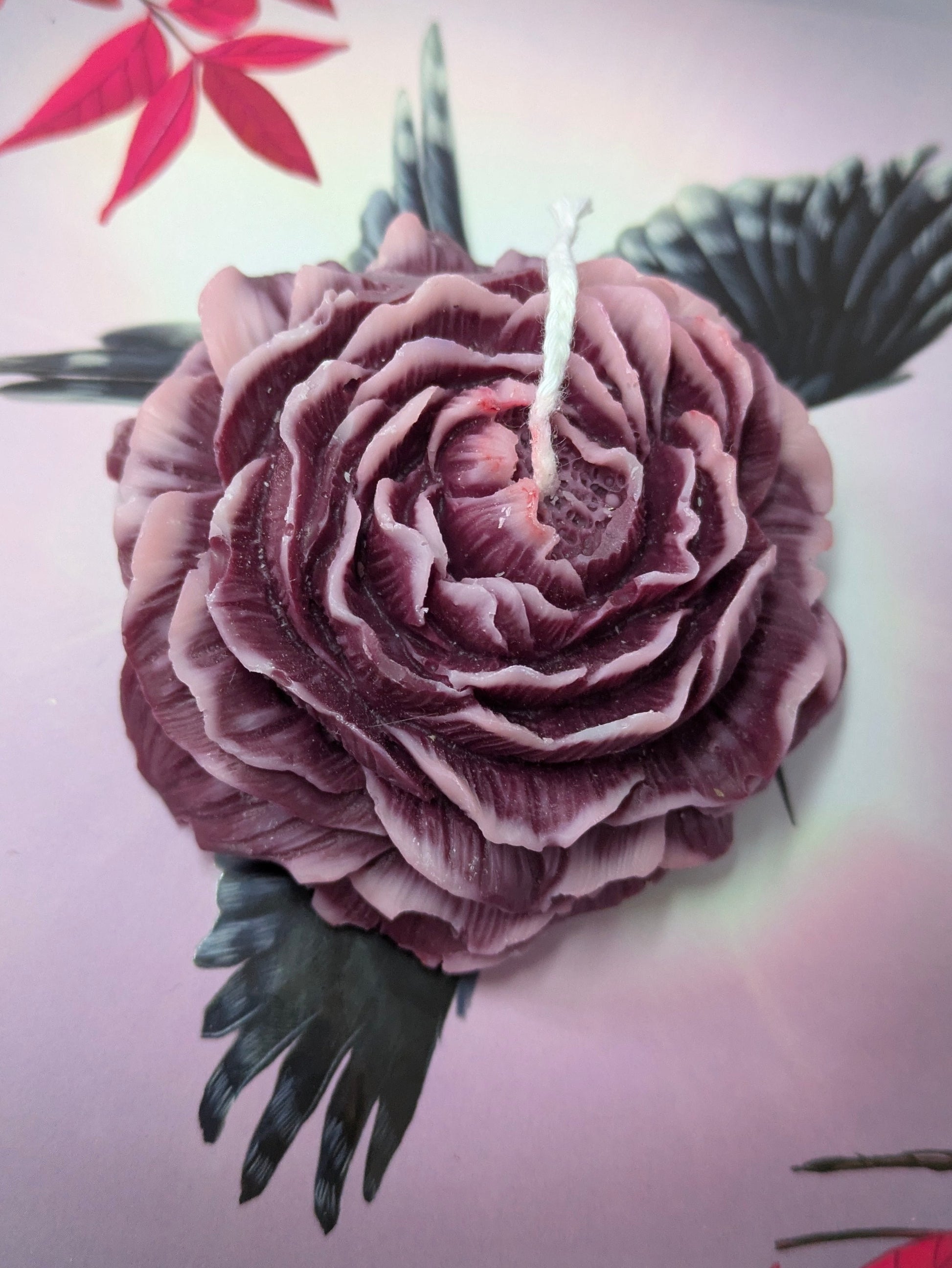 Purple Peony Rose candle by VitaUnlimited, featuring a decorative candle with a purple and rose floral design.