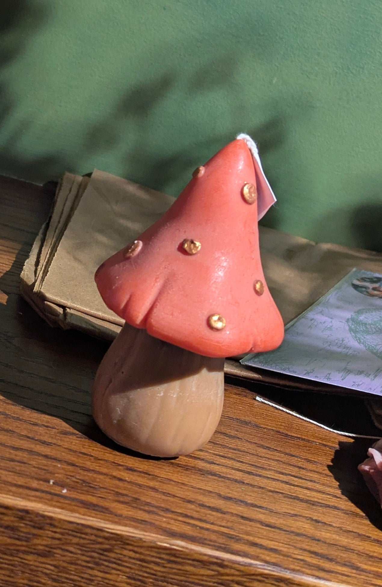 Tall mushroom-shaped candles by VitaUnlimited, featuring smooth cream-colored wax and elegant, rounded mushroom cap design.